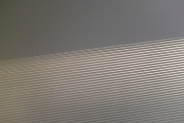 Minimal wall with texture pattern stripe soft sunlight sunrays 