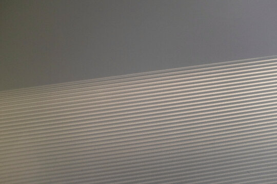 Minimal wall with texture pattern stripe soft sunlight sunrays 