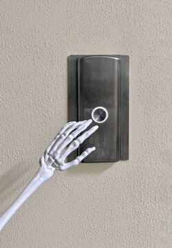 Skeleton Hand Pressing Elevator Button. 