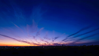 Fototapeta premium Vibrant Sunset Sky with Altocumulus Clouds in Warm Shades of Orange, Pink, and Purple Creating a Mesmerizing Scene.