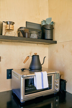 wooden kitchen utensils and microwave