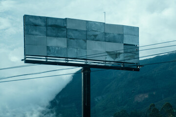 Empty Billboard with Mountains and Clouds