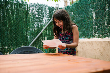 Excited Girl Reading Letter