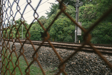 Metro Rails Behind Metal Fence