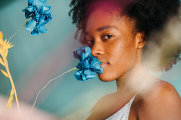 Beautiful black woman with flowers
