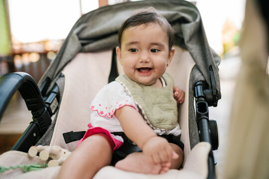Smiling baby in pram