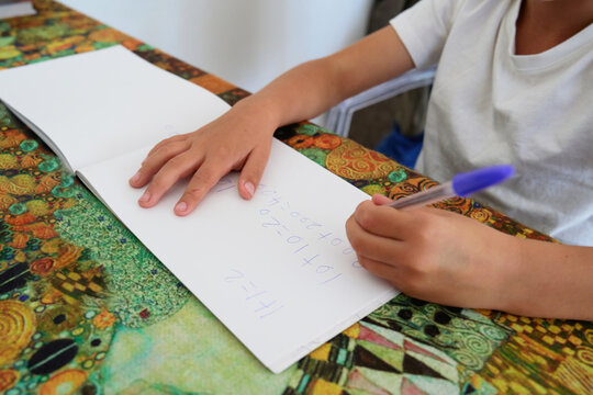 Child Writing basic math