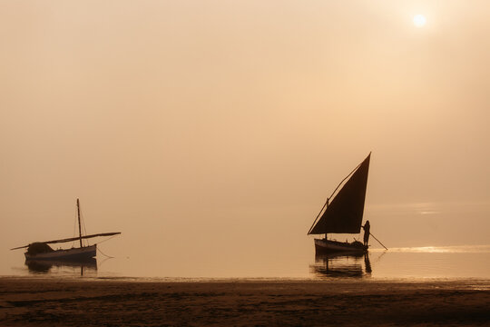 Fishing dhows at dawn on a misty morning Mozambique