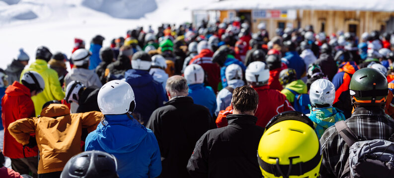 Large Crowd of Skiers and Snowboarders Waiting in Line