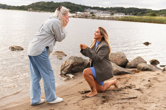 LGBT Woman Couple's Surprise Beach Proposal at Sunset