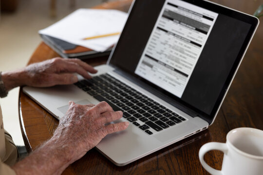 Senior hand laptop computer online veteran medical benefits 
