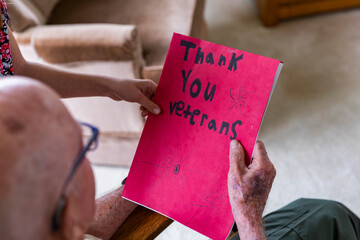 Girl give card portrait thanking veteran tribute 