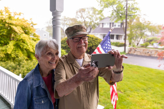 Senior Citizen Veteran selfie  Portrait mobile phone porch with wife 