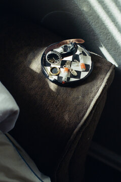 Clay trinket dish with jewelry and watch