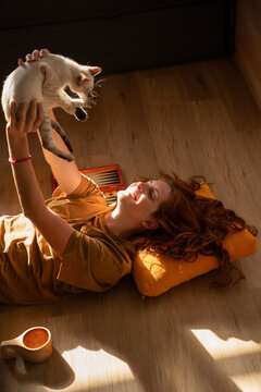 Woman Playing with Cat