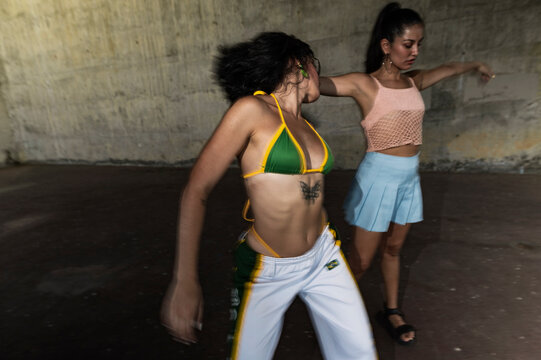 Women friends dancing at urban party, lo-fi 