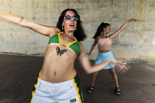 Multiracial friends dancing with vibrant expressions