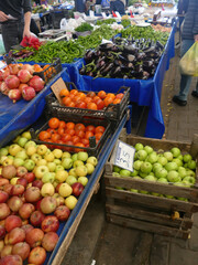 Street vendor selling fresh fruits and vegetables at the farmers market