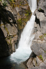 Christine falls surges through a narrow canyon