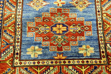 Details of intricate blue patterns in Turkish carpets