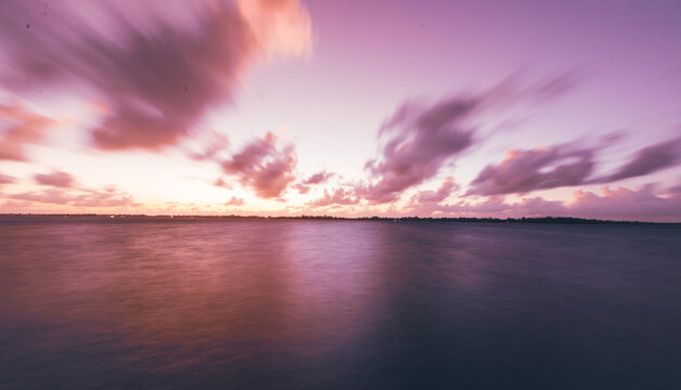 Sunset with a purple sky over the south pacific ocean in French Polynesia. 