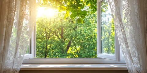 opened white plastic window at windowsill and lacy curtains against green trees under bright sunlight on summer day. with copy space image. Place for adding text or design 