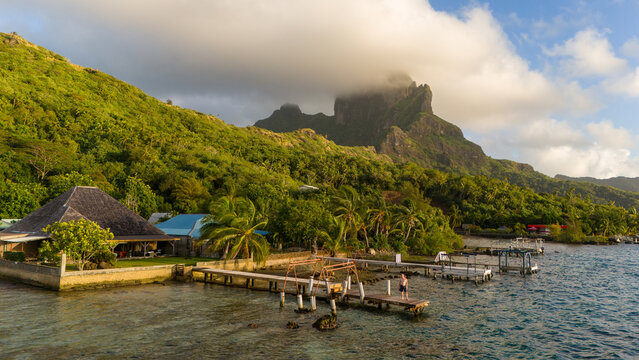 Aerial view captured by drone of the tropical island Bora Bora in French Polynesia. The beautiful travel destination is popular with tourists around the world. 
