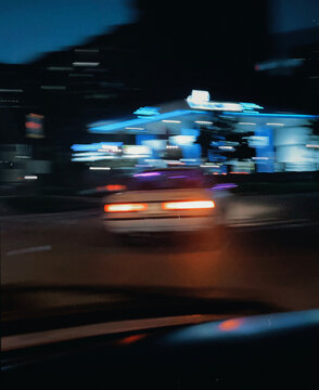 Blurry Nighttime Car in Motion