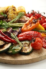 Delicious grilled vegetables on white table, closeup