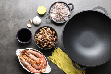 Ingredients for wok on grey table, flat lay