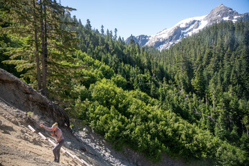 View of Mount Olympus with Woman Climbing up Rope Ladder