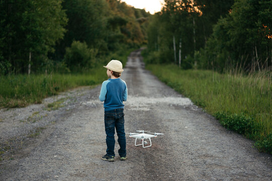 Young Explorer With Drone on Country Pathway