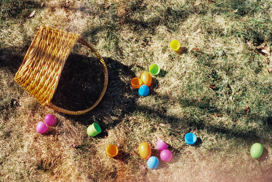 Tipped Over Easter Basket in Grass with Plastic Eggs