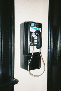 Old Wall-Mounted Payphone shot with Direct Flash on Film