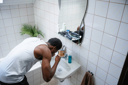 A man washes his face