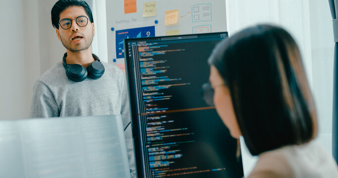 Group adult Asia male female software developers mentor leader manager talk strategy plan to executive write prompt AI bot IT app program nomad, video game, data center. Whiteboard slideshow code.