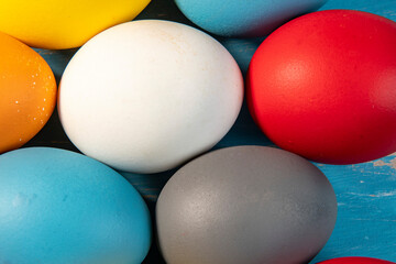 eggs painted in different colors to symbolize the passage of Christian Easter