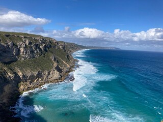 Dramatic sea cliffs over turquiose ocean