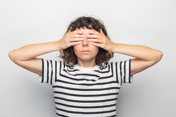 Young woman covering her eyes
