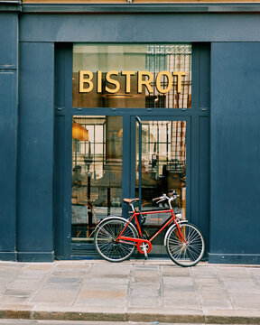 Charming Bistro Entrance with Red Bicycle