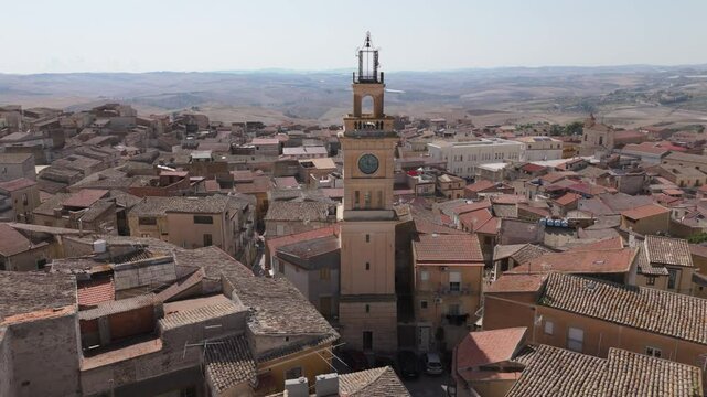 flying clockwise around clock tower in Sommatino Sicily