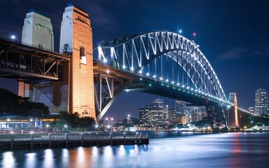 Obraz premium Harbour Bridge at Night: Illuminated Sydney Skyline with Reflections Background