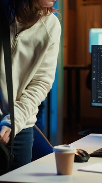 Vertical video Computer scientist arriving in home office, ready to design and develop software applications. IT expert starting job shift, implementing and maintaining company systems, camera A