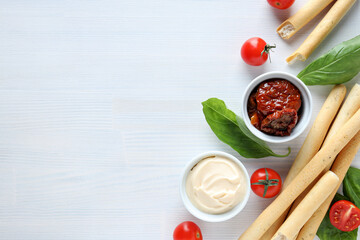 The concept of Italian cuisine, sun-dried tomatoes on a light background.