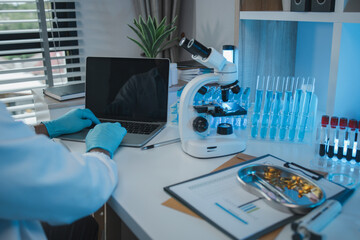 working atmosphere in the laboratory, chemistry and science specialist working in a lab with various experimental equipment and substances, experimental professional working in the lab