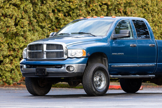 Beaverton, OR, USA - Dec 14, 2021 - Blue Dodge Ram Laramie 4x4 heavy duty off-road American pickup truck exterior outside. High quality picture for download