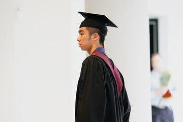 A student in his graduation gown