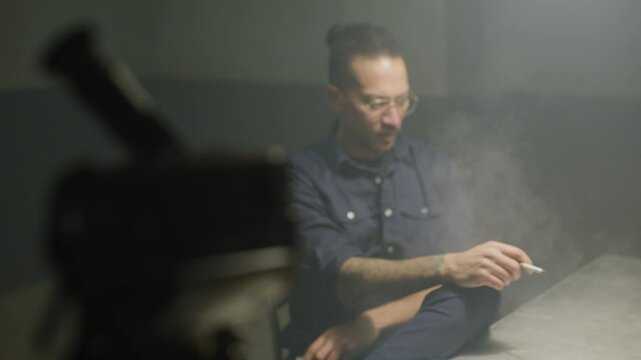 Inmate smoking in an interrogation with police