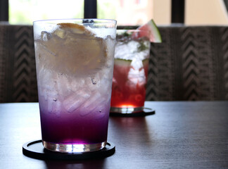 Lemon and blueberry soda in a glass of ice.