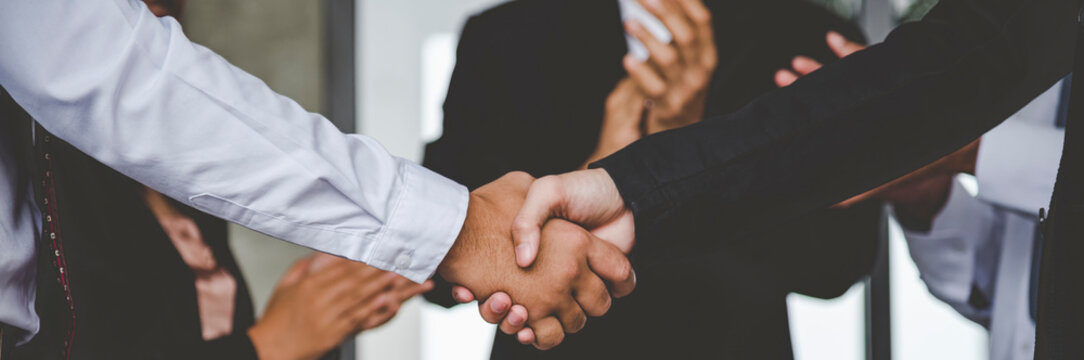 Banner Lawyer teamwork partnership Businessman handshake together. Panorama Two Men Trust honesty lawfirm business handshake promise respect partner. Diversity solidarity team Partner hands together